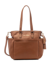 A caramel-colored tote bag made from vegan leather with gold hardware, featuring a structured design with a top zipper, and carrying handles.
