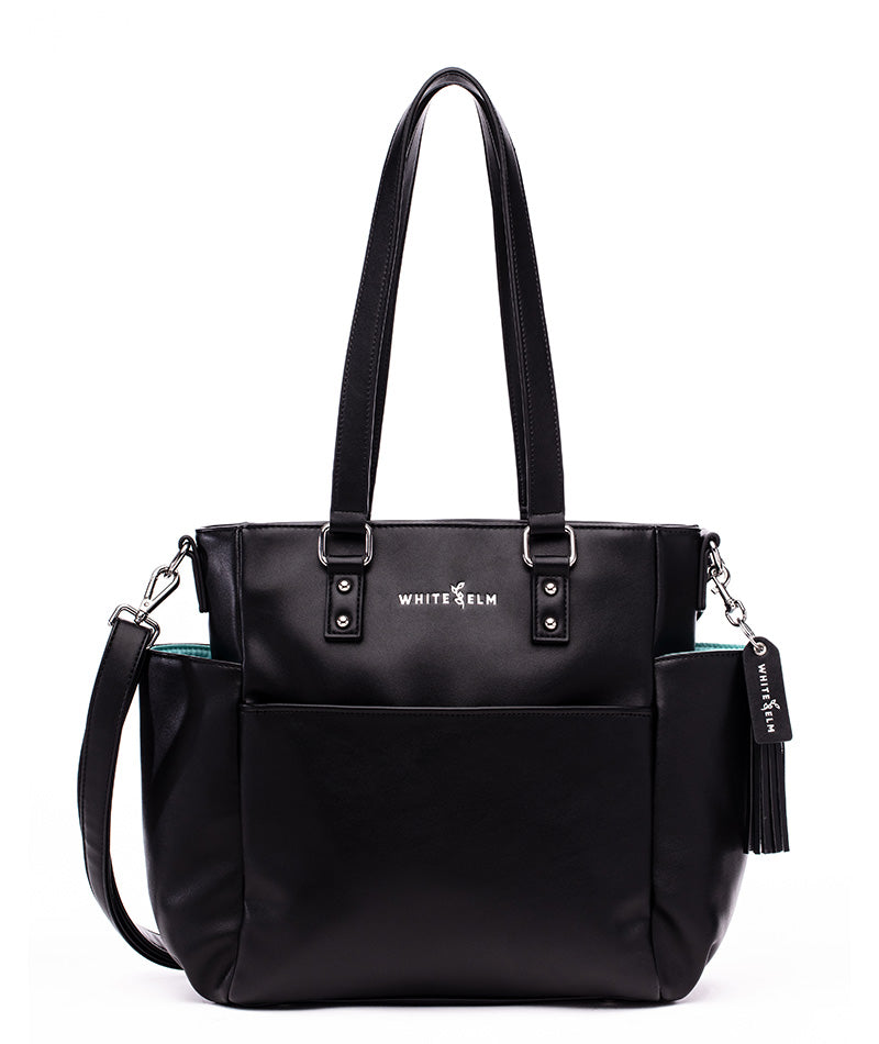 A black vegan leather tote bag with two handles and a detachable shoulder strap, featuring multiple pockets and the brand name 'White Elm' on the front.