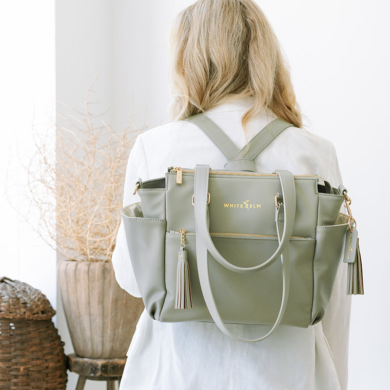 light sage green backpack with pockets and gold hardware gemini mini by white elm