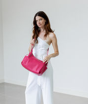 Dragon Fruit Camille hobo bag worn crossbody with the adjustable strap
