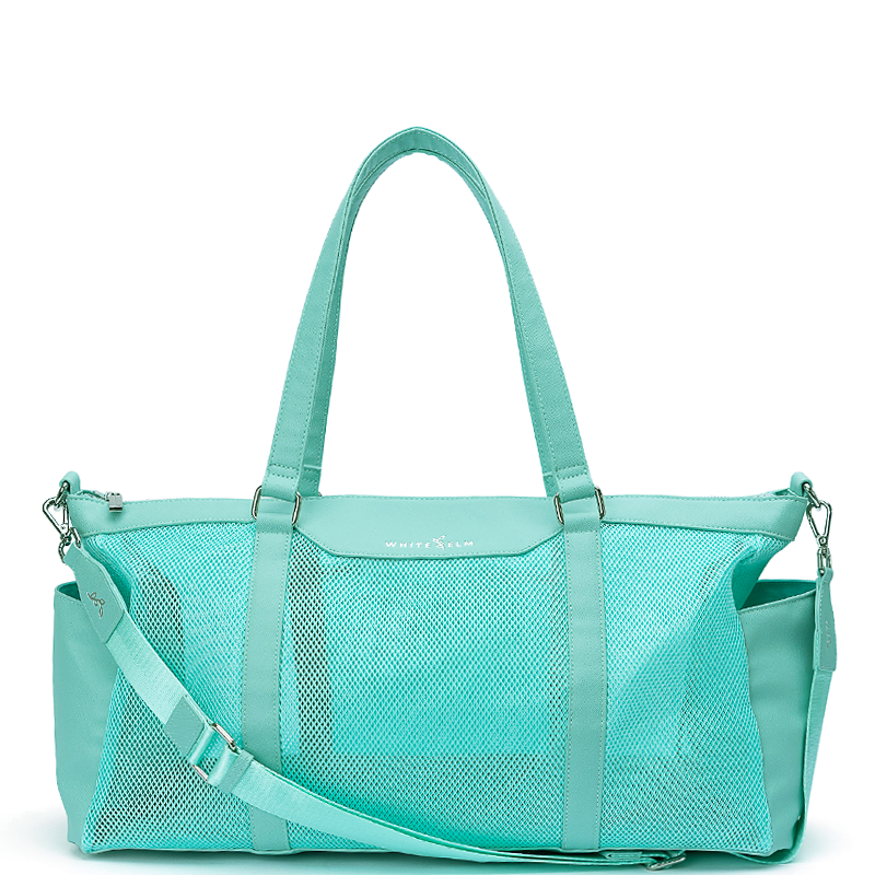 A white elm carmen mint aqua blue green vegan leather and mesh duffel bag with matching top handles and a detachable shoulder strap, shown on a plain white background.