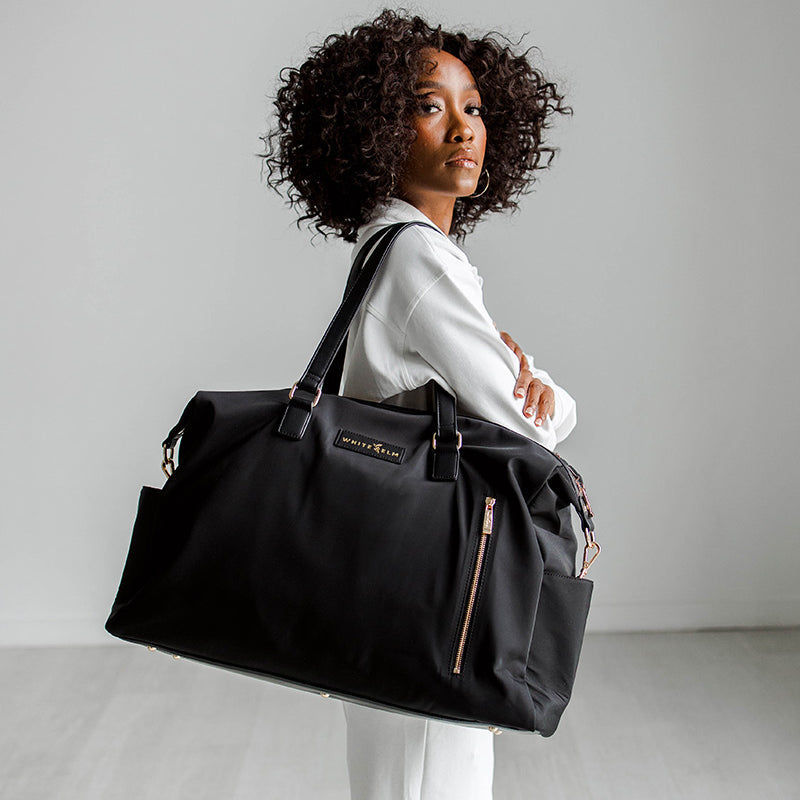 WhiteElm_DarciWeekenderDuffel_Black_Gold_Shoulder.jpg