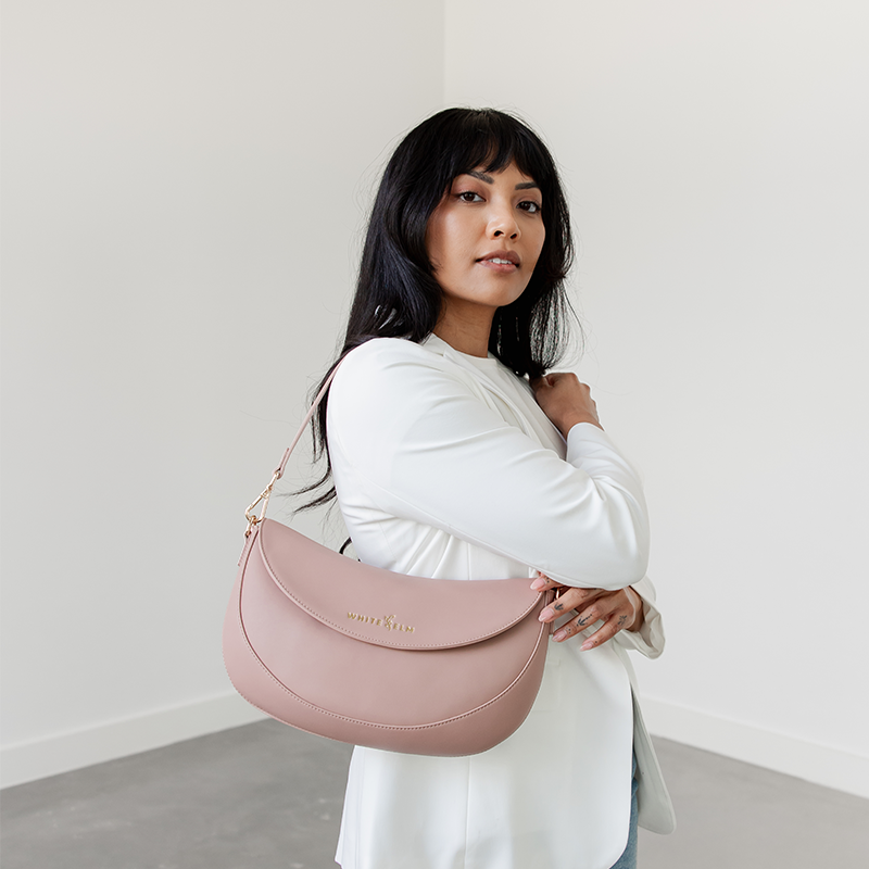 Dusty Rose Emily Crescent bag worn over the shoulder, alternate angle