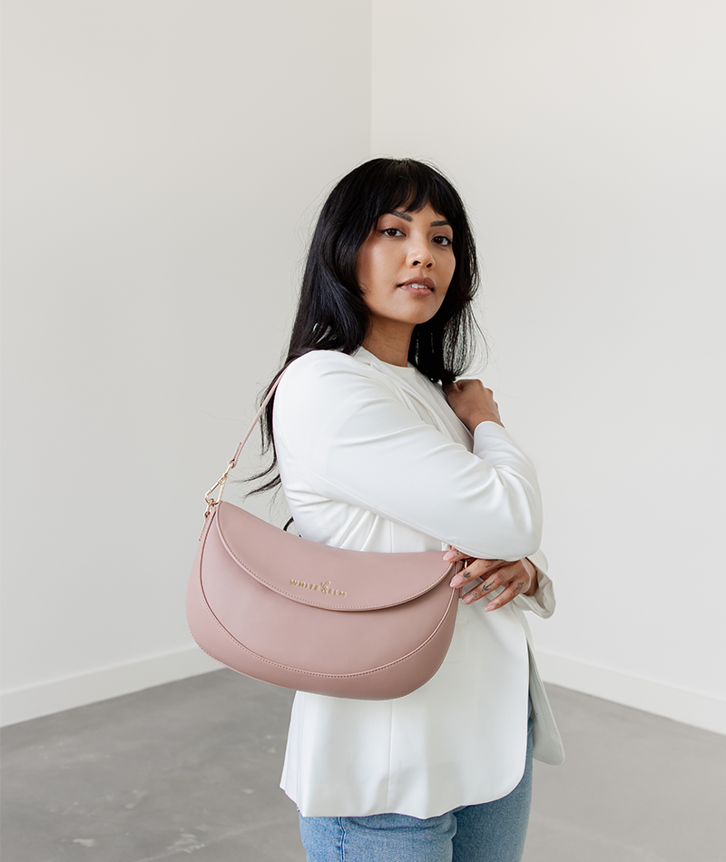 Dusty Rose Emily Crescent bag worn over the shoulder, alternate angle