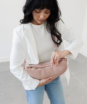 Close-up of the zipper closure on the Dusty Rose Emily Crescent bag