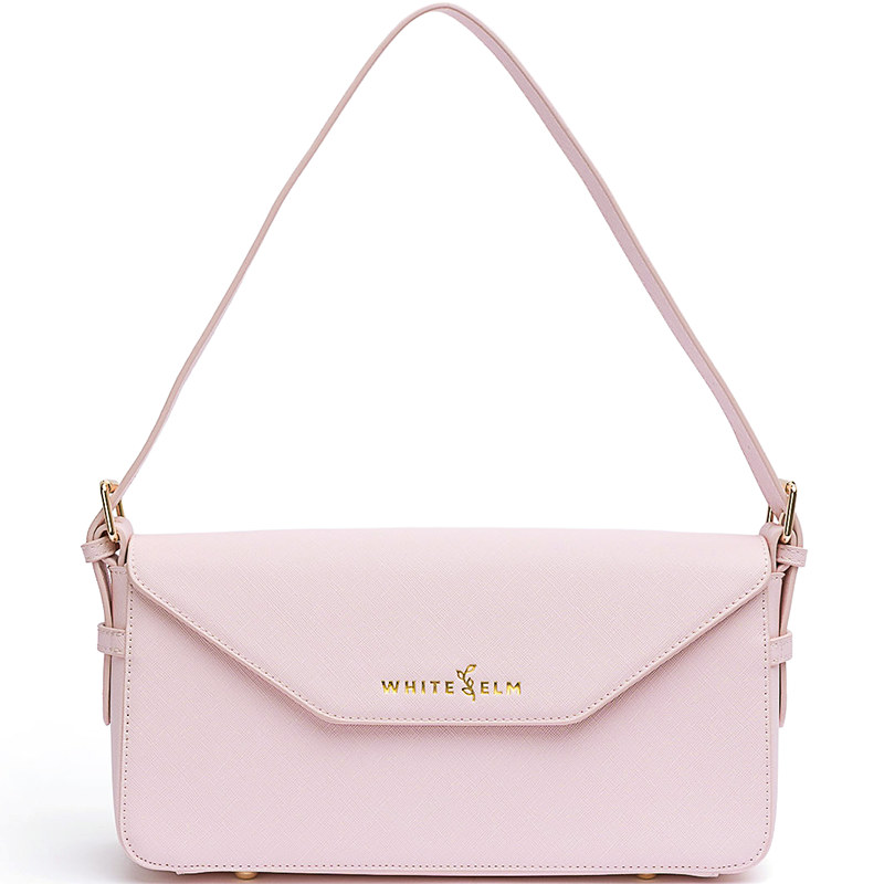 Noemi blush pink vegan leather east west bag with gold hardware and envelope flap closure