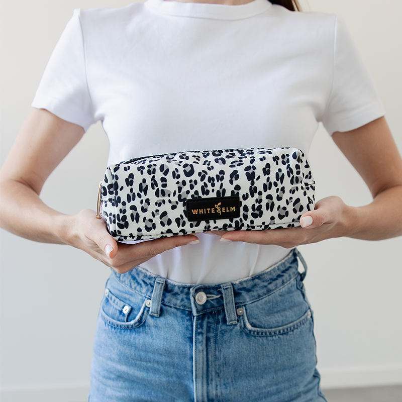 WhiteElm_Penny_Leopard_Holding.png