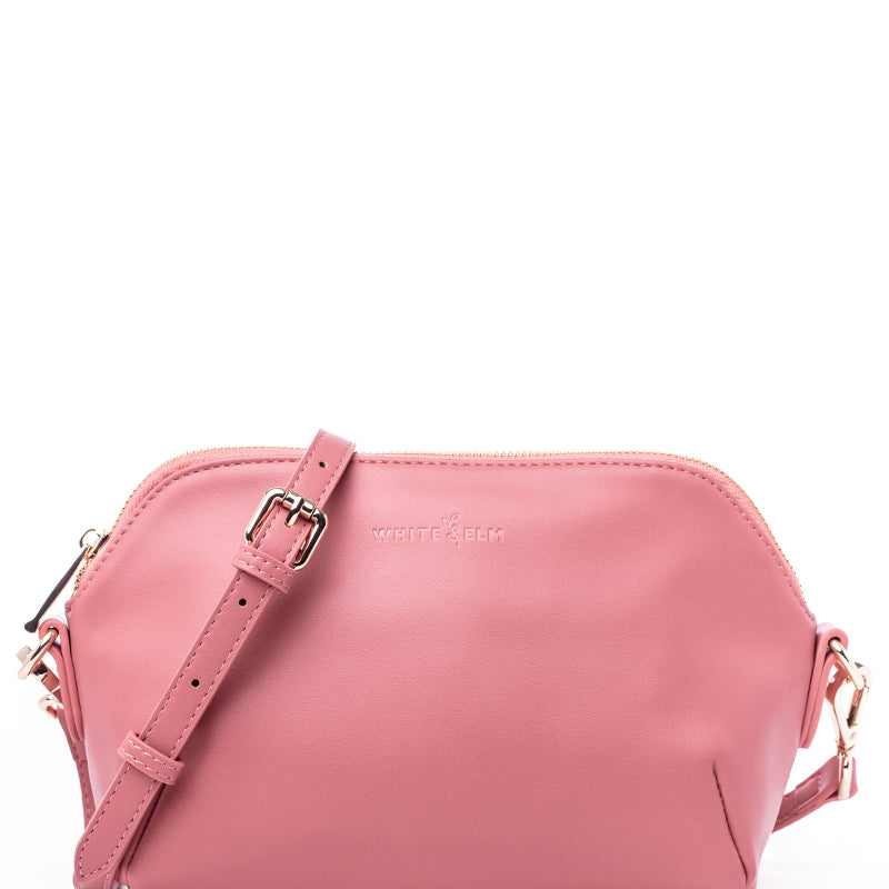 Pink crossbody handbag with a strap by white elm